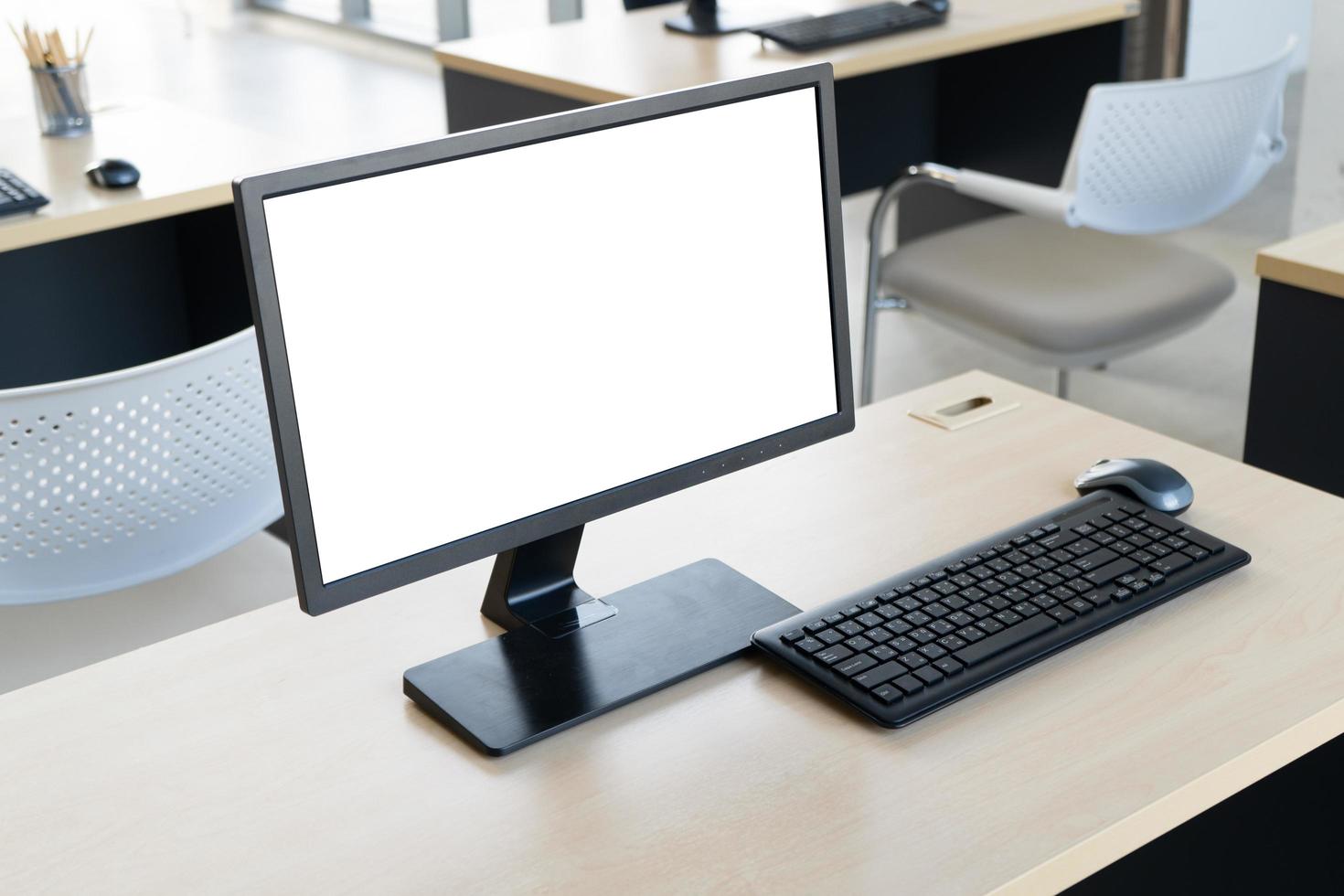 Computer with white screen on the table photo