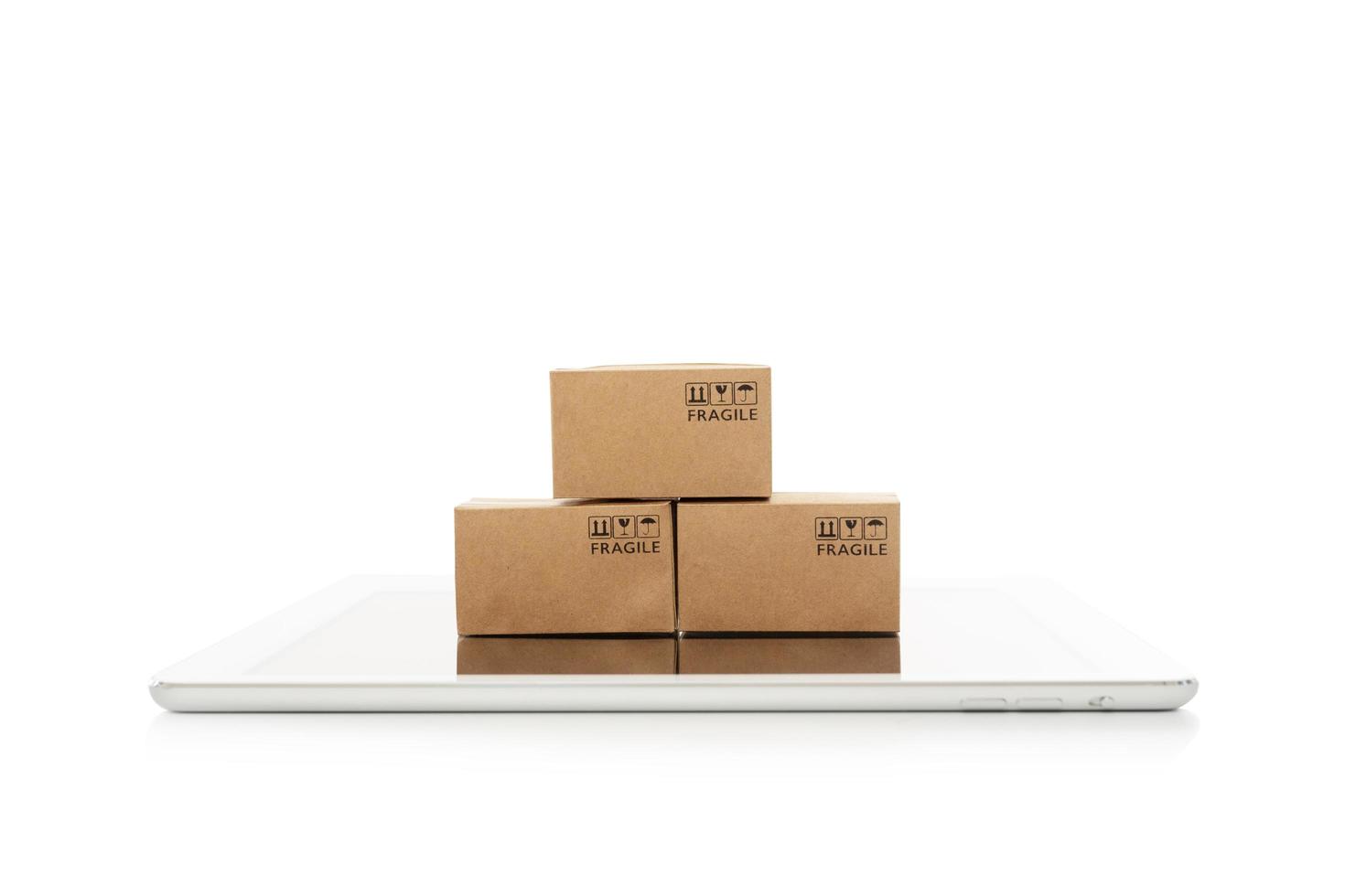 Paper boxes with tablet on white background,Online shopping or ecommmerce concept photo