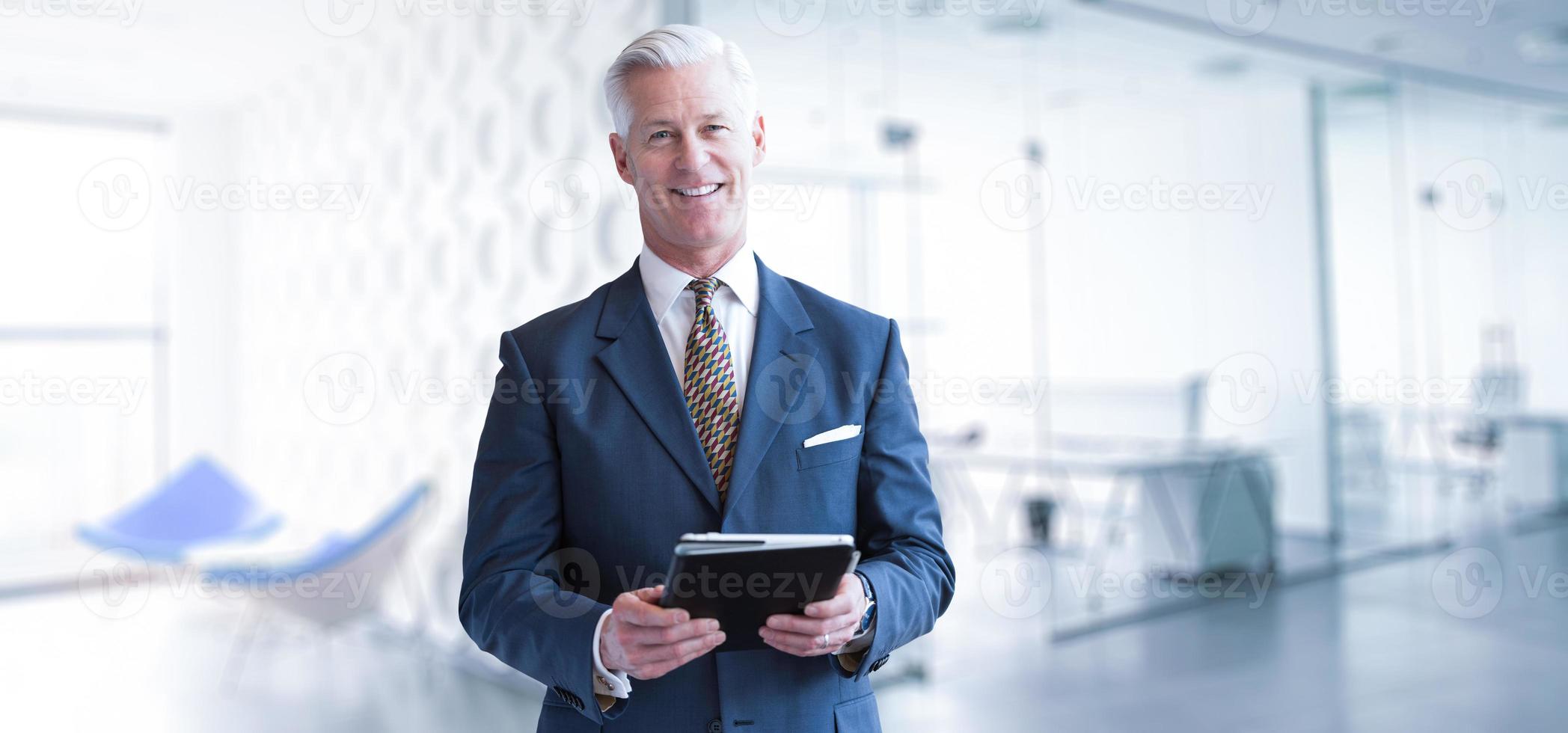 Senior businessman in his office photo