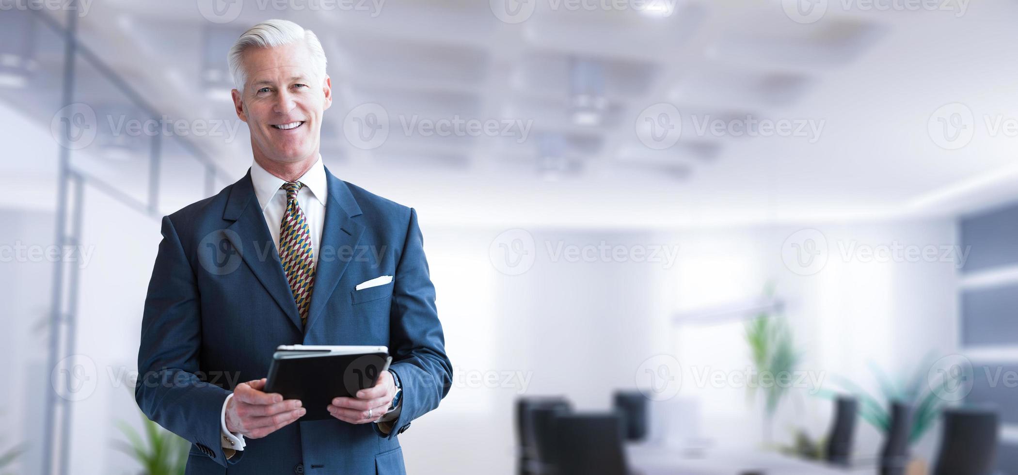 Senior businessman in his office photo