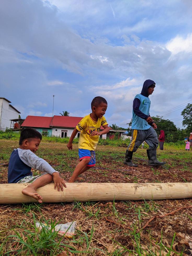 children playing together, east kalimantan, indonesia, august, 13,2022 photo