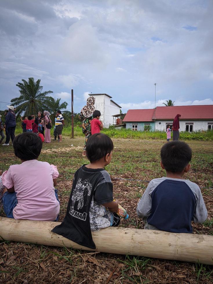 children playing together, east kalimantan, indonesia, august, 13,2022 photo