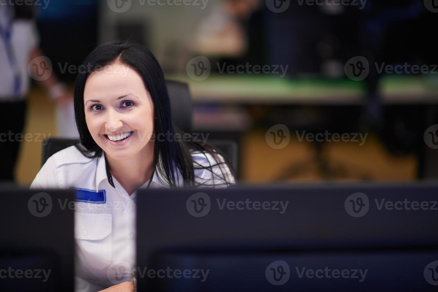 portrait of Female operator in a security data system control room photo