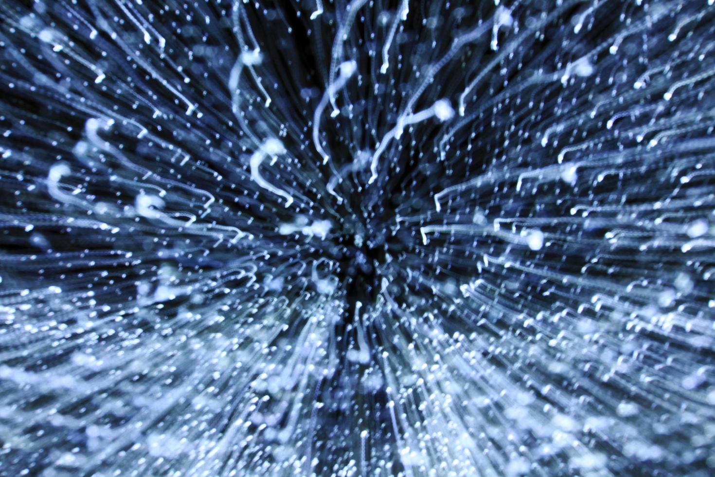Blurred white light background. Abstract art of lighting blur wallpaper at festival. Defocus and zooming concept. photo