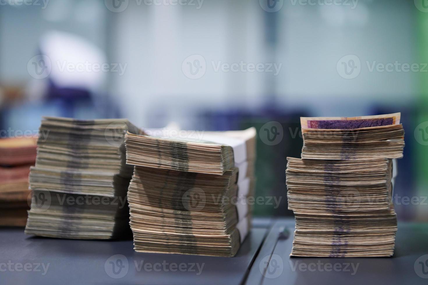 banknotes in front of electronic money counting machine photo