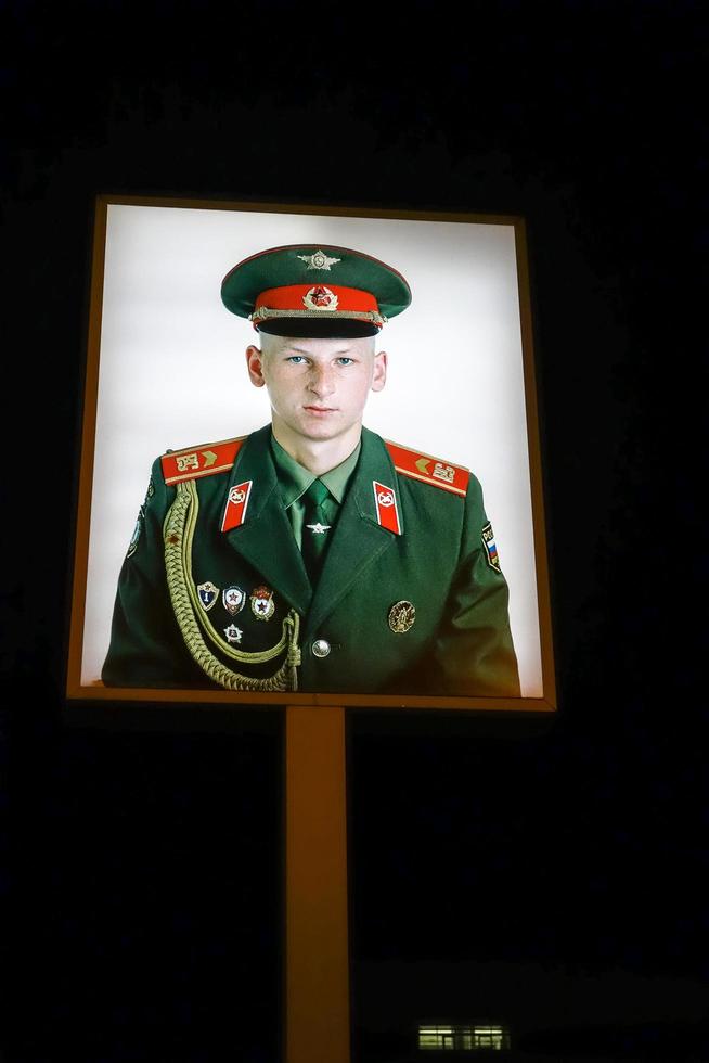 Berlin Germany, 2014. Illuminated photograph of a Soviet soldier at Checkpoint Charlie in Berlin photo