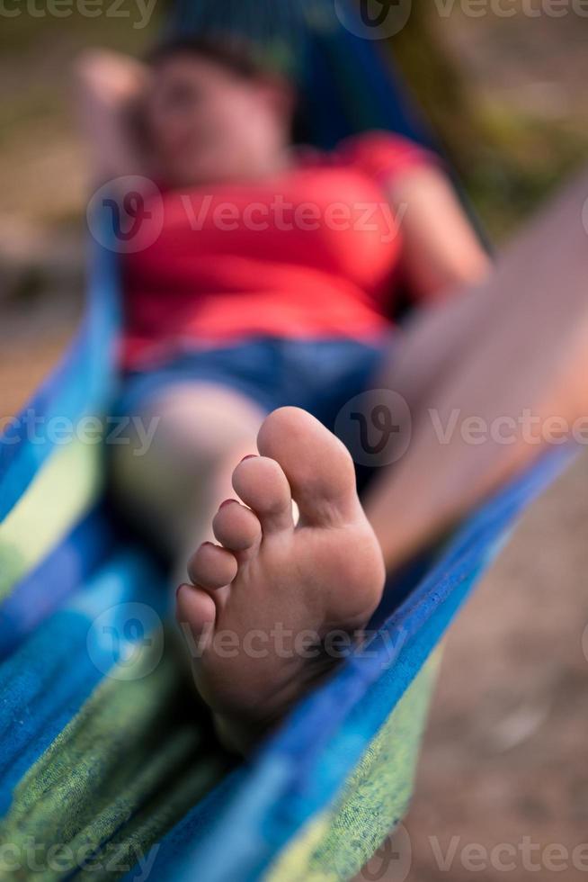 woman resting on hammock photo