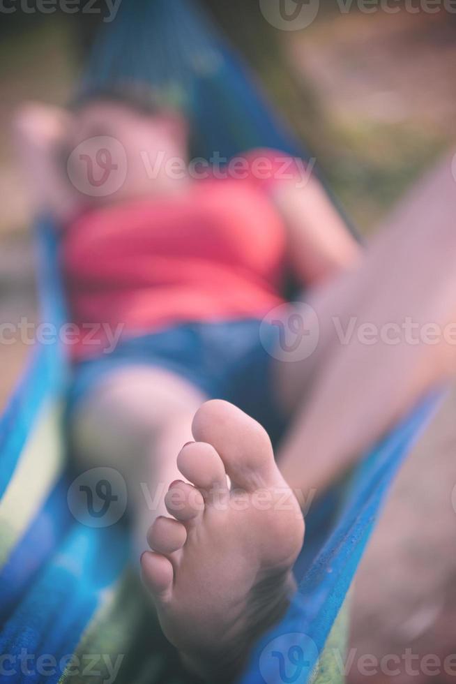 woman resting on hammock photo