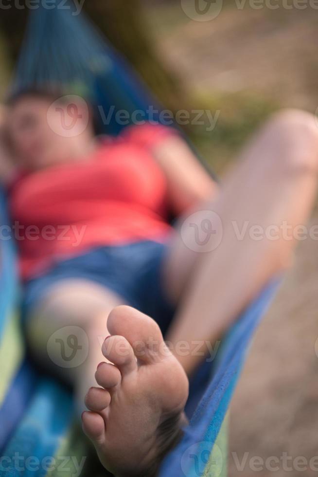 woman resting on hammock photo