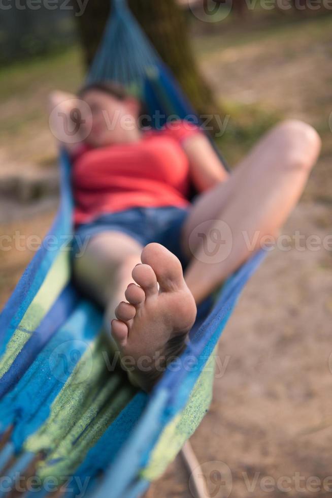 woman resting on hammock photo