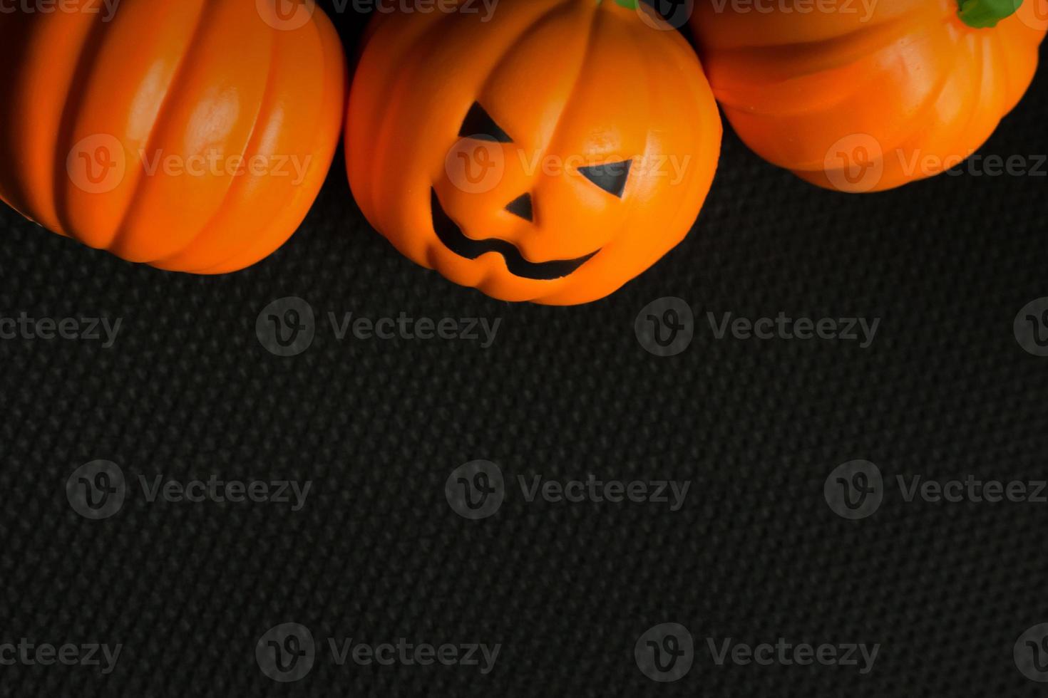 The halloween pumpkin jack in black holiday background image. photo