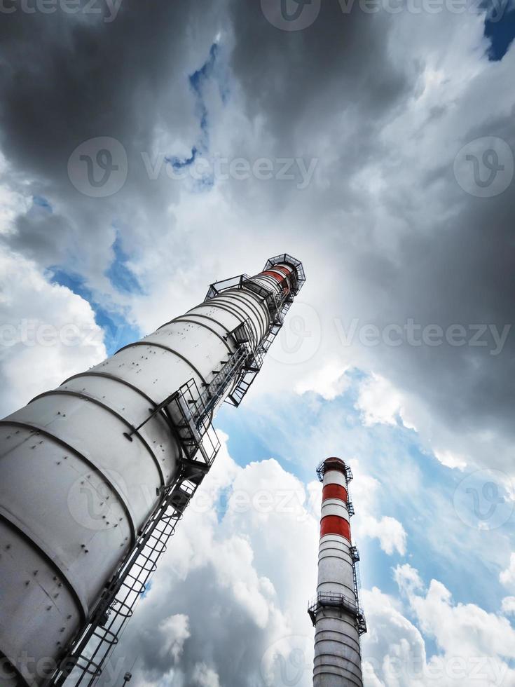 Two chimneys of the power plant diagonally photo