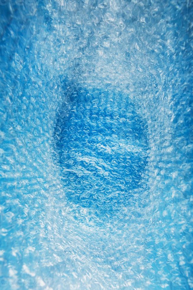 Inner space in a bag of packaging air-bubble film on a blue background in full screen photo