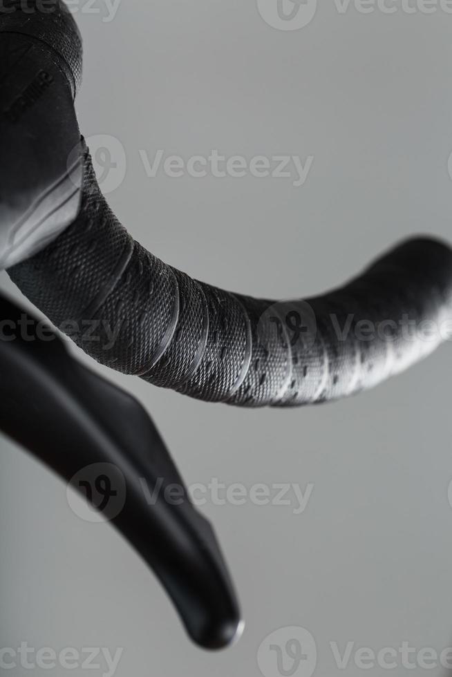 Steering wheel winding with brake handle of a road bike close-up photo