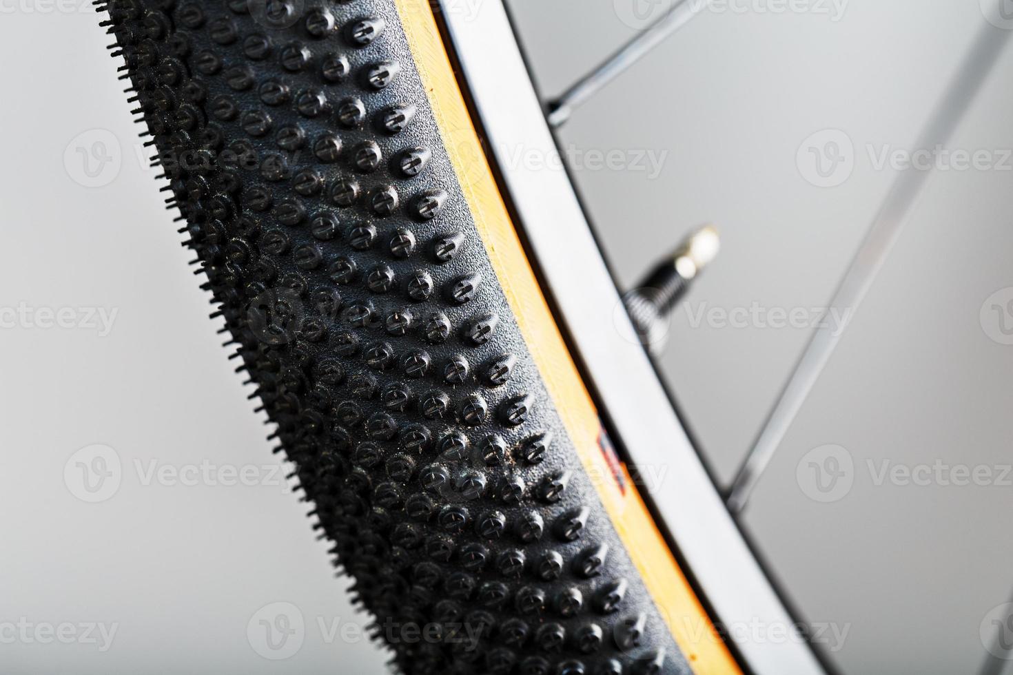 Shallow tread of a bicycle tubeless tire with a brown sidewall photo