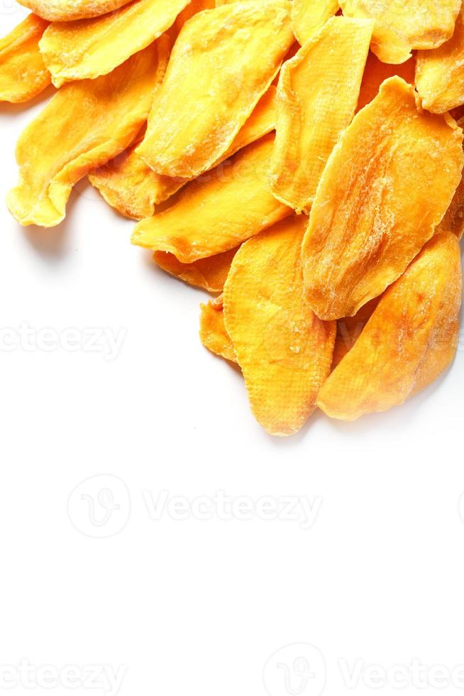 Dried mango sliced on a white background with free space photo