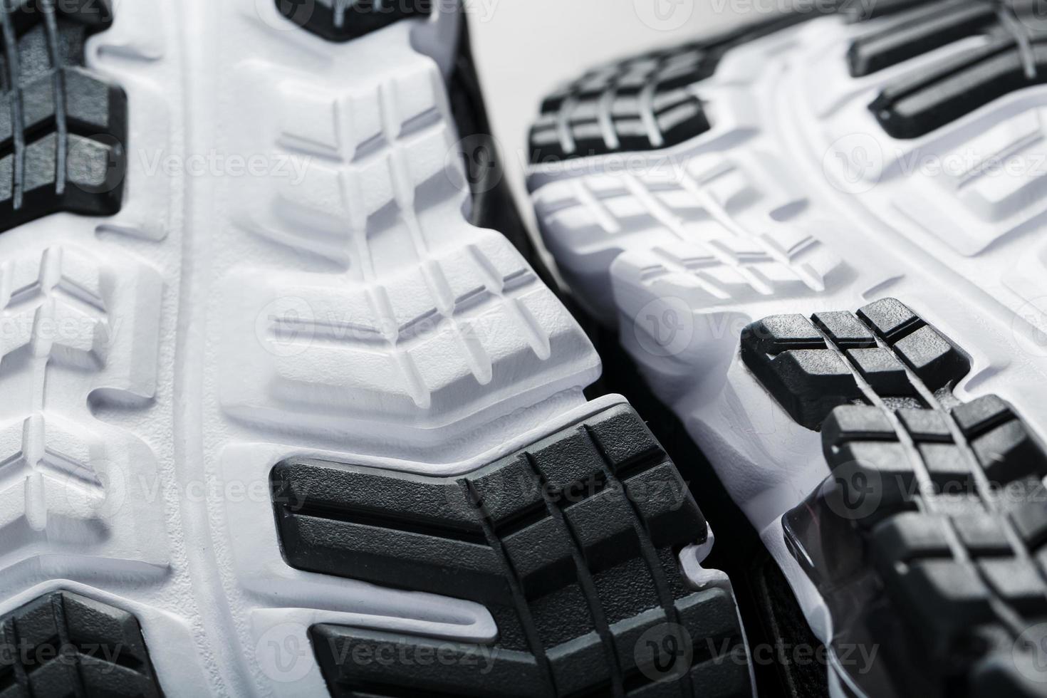 The sole of the sports sneakers for running in black and white close-up photo