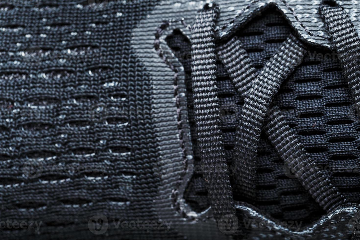 Mesh of black sports sneakers for training Macro photo