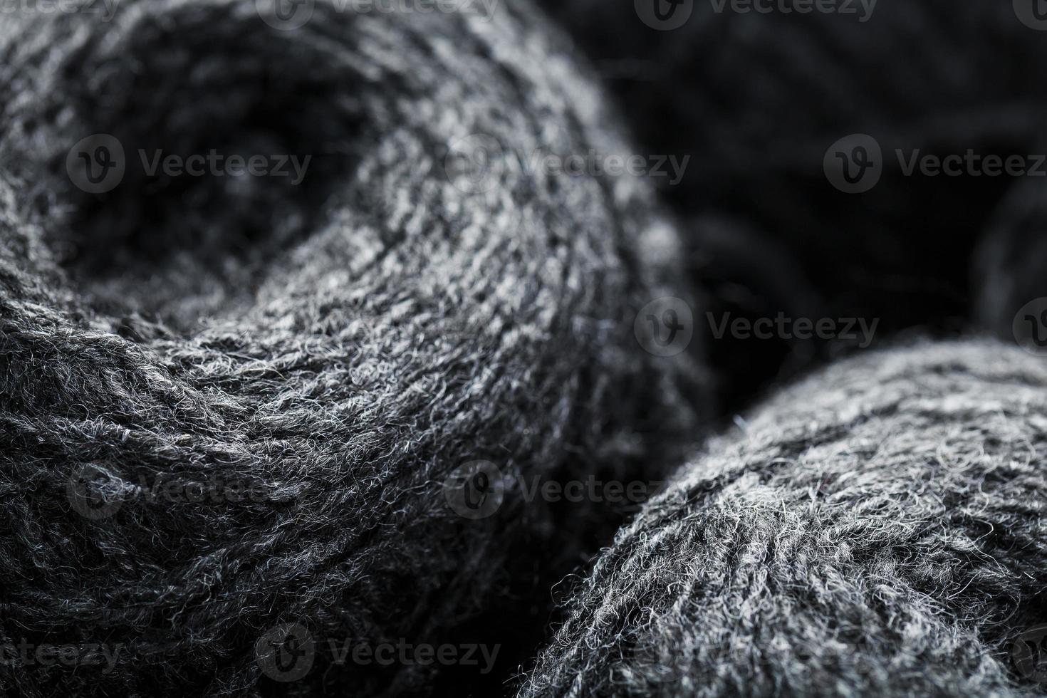 Gray yarn made of natural wool in balls of thread. photo