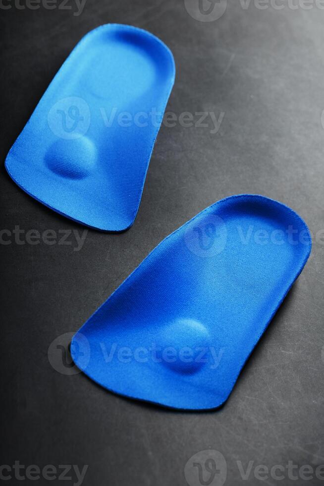 Orthopedic insoles for correction of the blue color of the foot on a