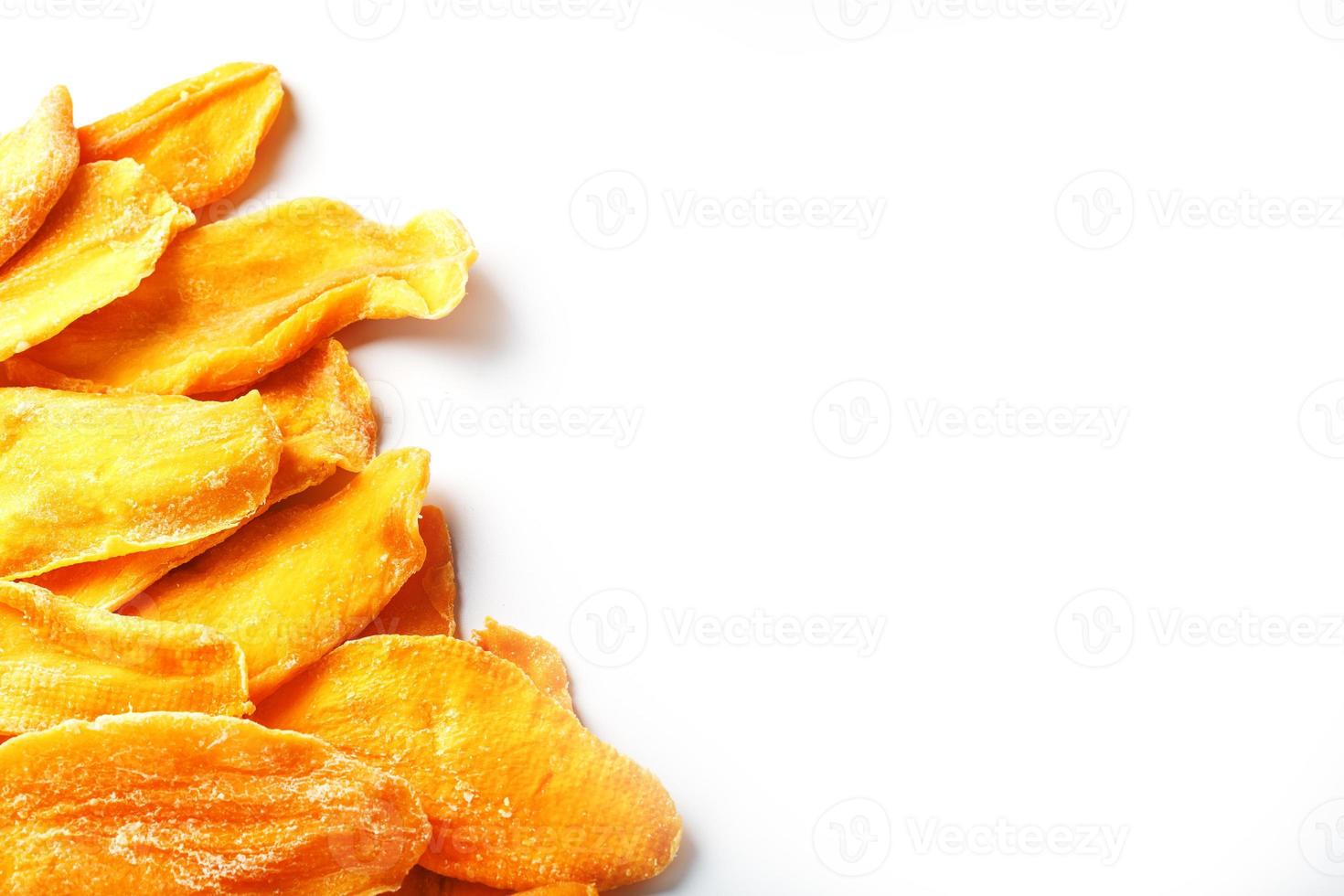 Dried mango sliced on a white background with free space photo