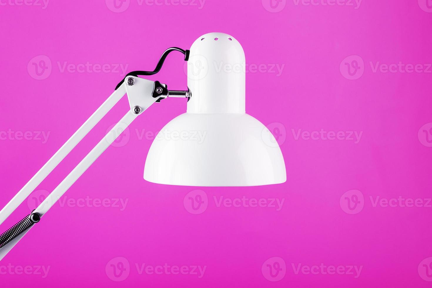 Classic table lamp on pink background with space for text and idea concept photo