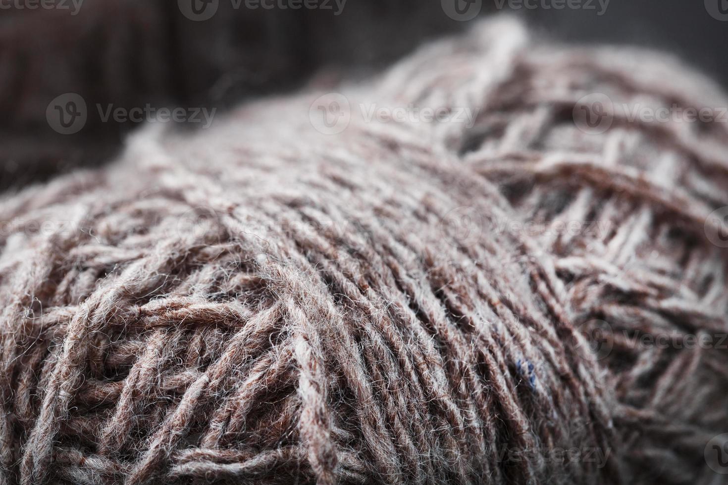 Light brown wool yarn made of threads in tangles. photo