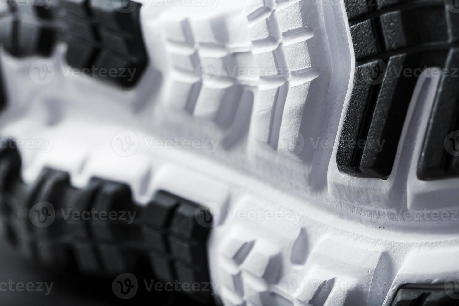 The sole of the sports sneakers for running in black and white close-up photo