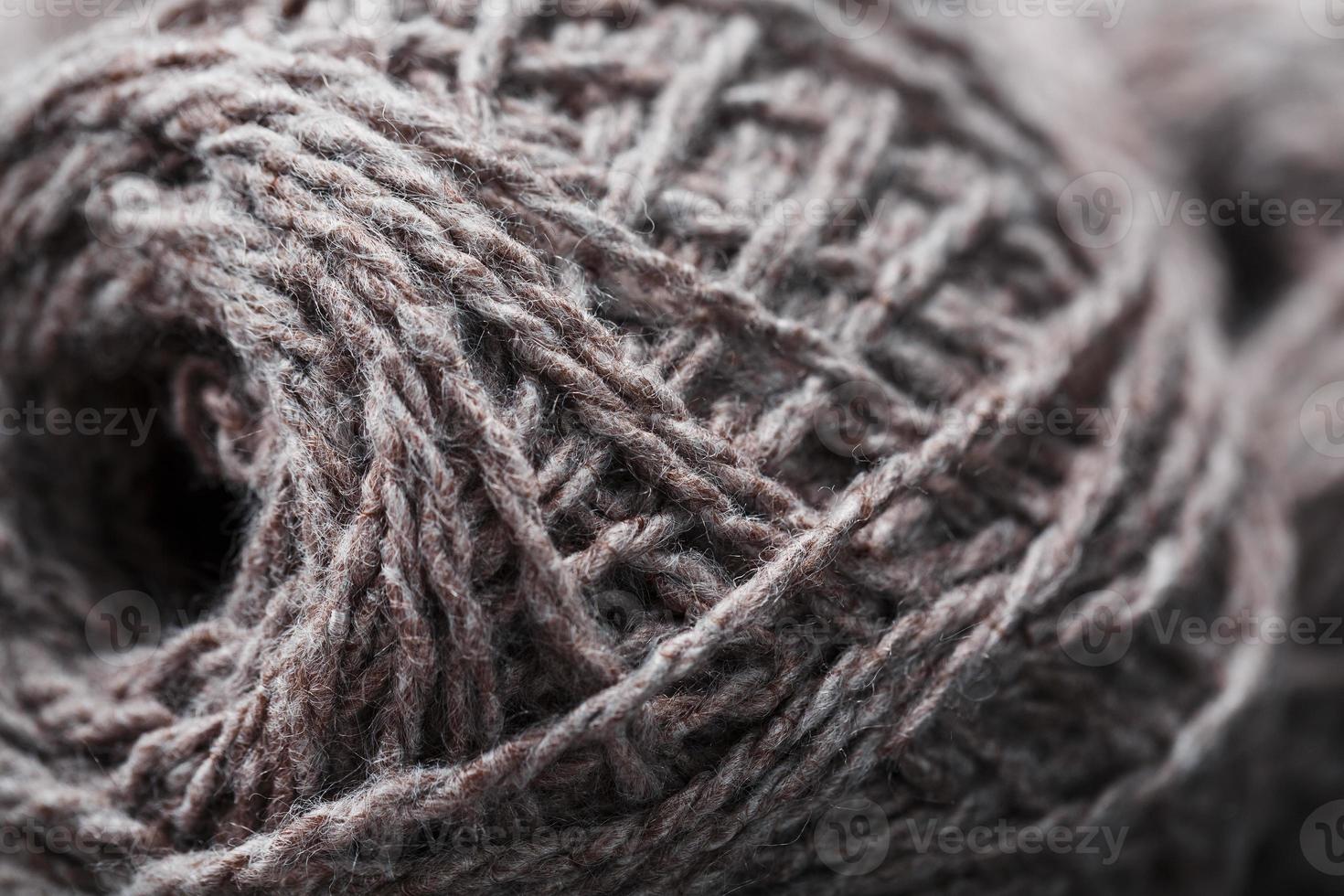 Light brown wool yarn made of threads in tangles. photo