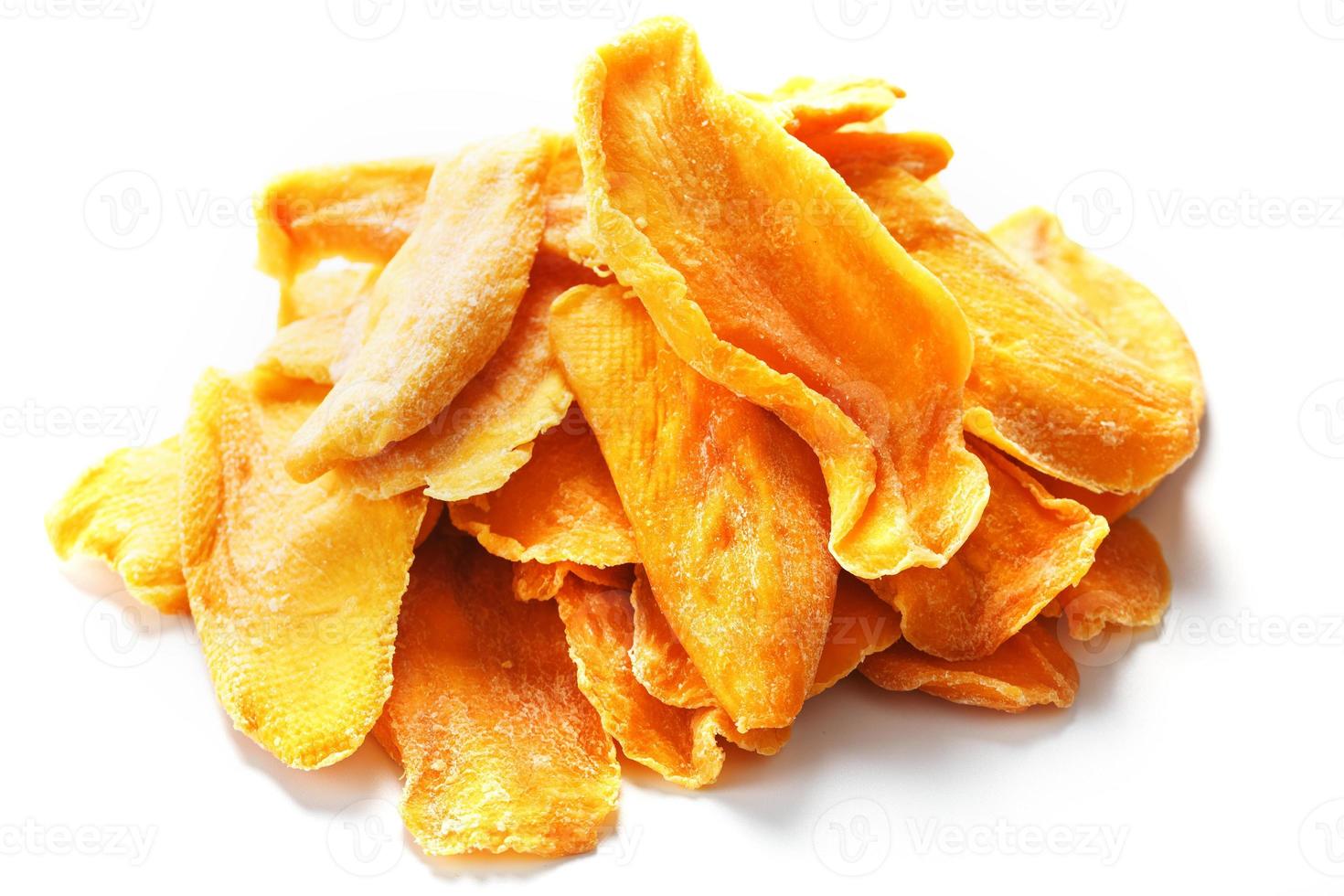 Dried mango sliced on a white background with free space photo