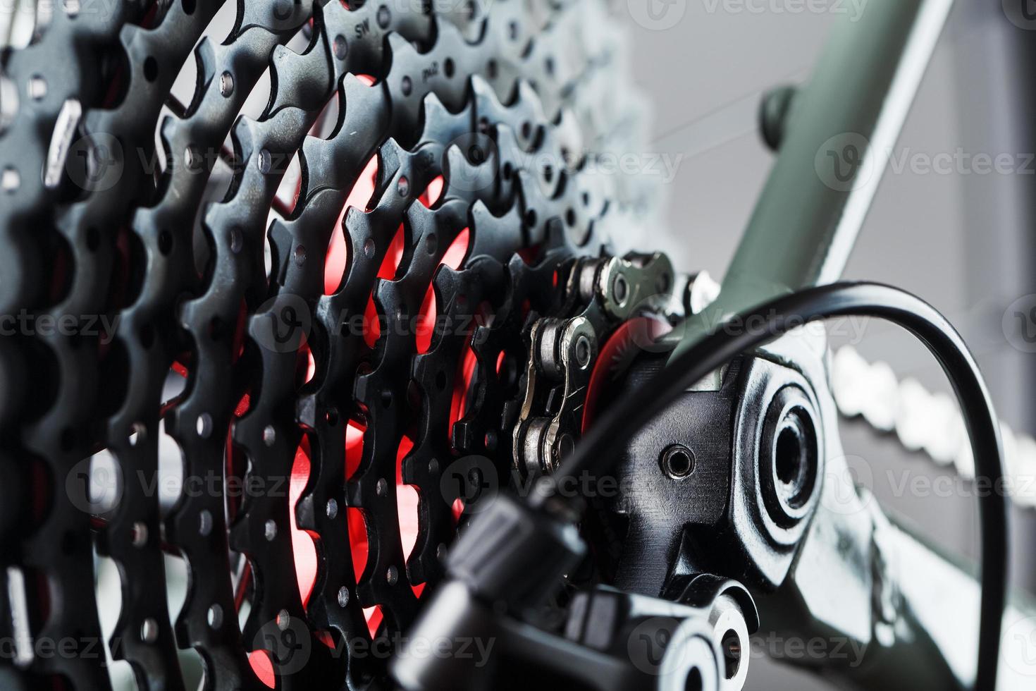 Rear bicycle cassette speeds with a wide range and chain close-up photo