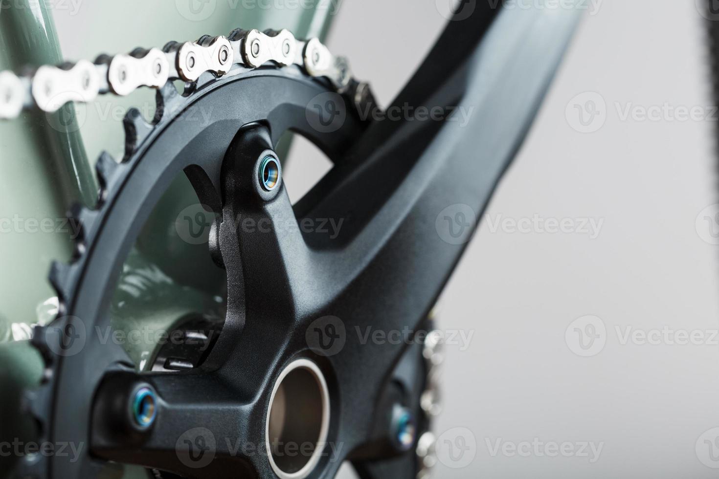 The leading star of a bicycle with a connecting rod and a chain close-up photo