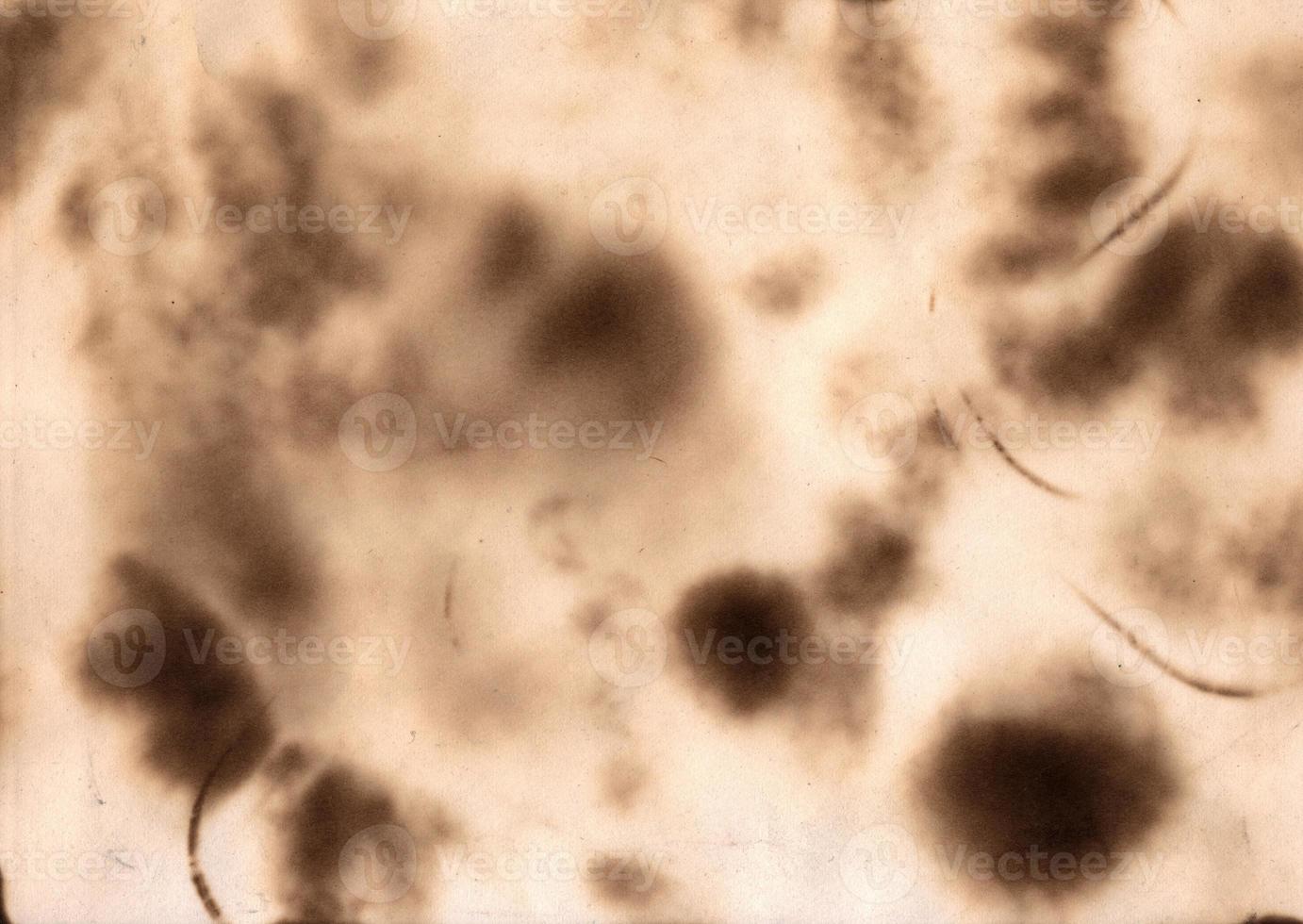 Abstract burned paper background. Vintage style parchament effect. Ripped edges frame photo