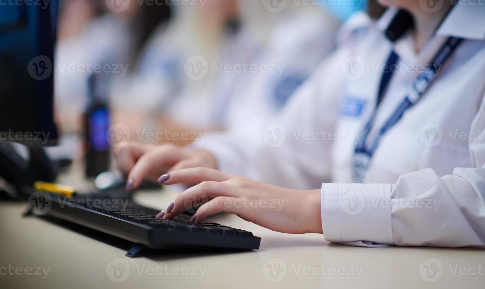 Female security guards working in a security data system control room photo