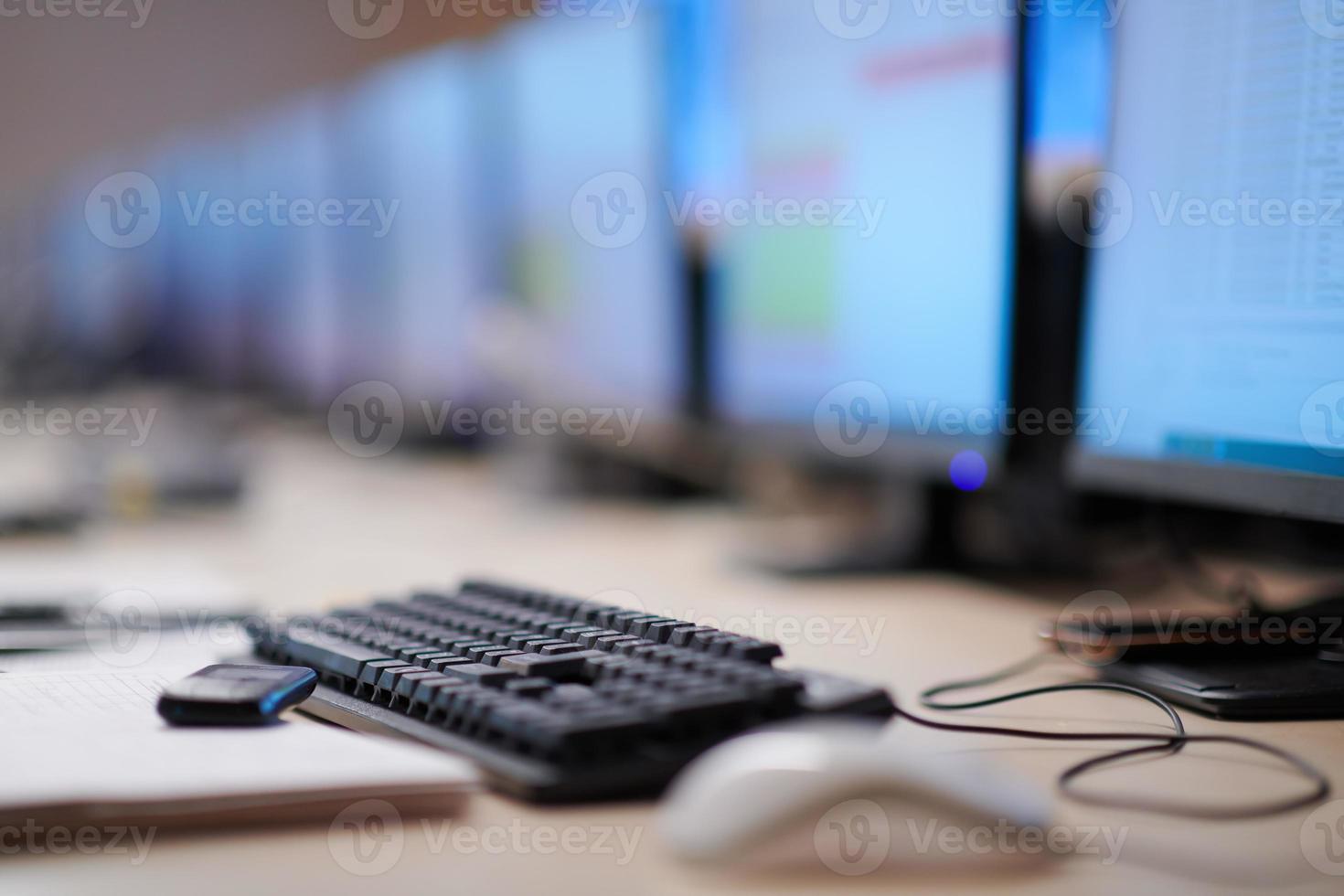 Empty interior of big modern security system control room photo