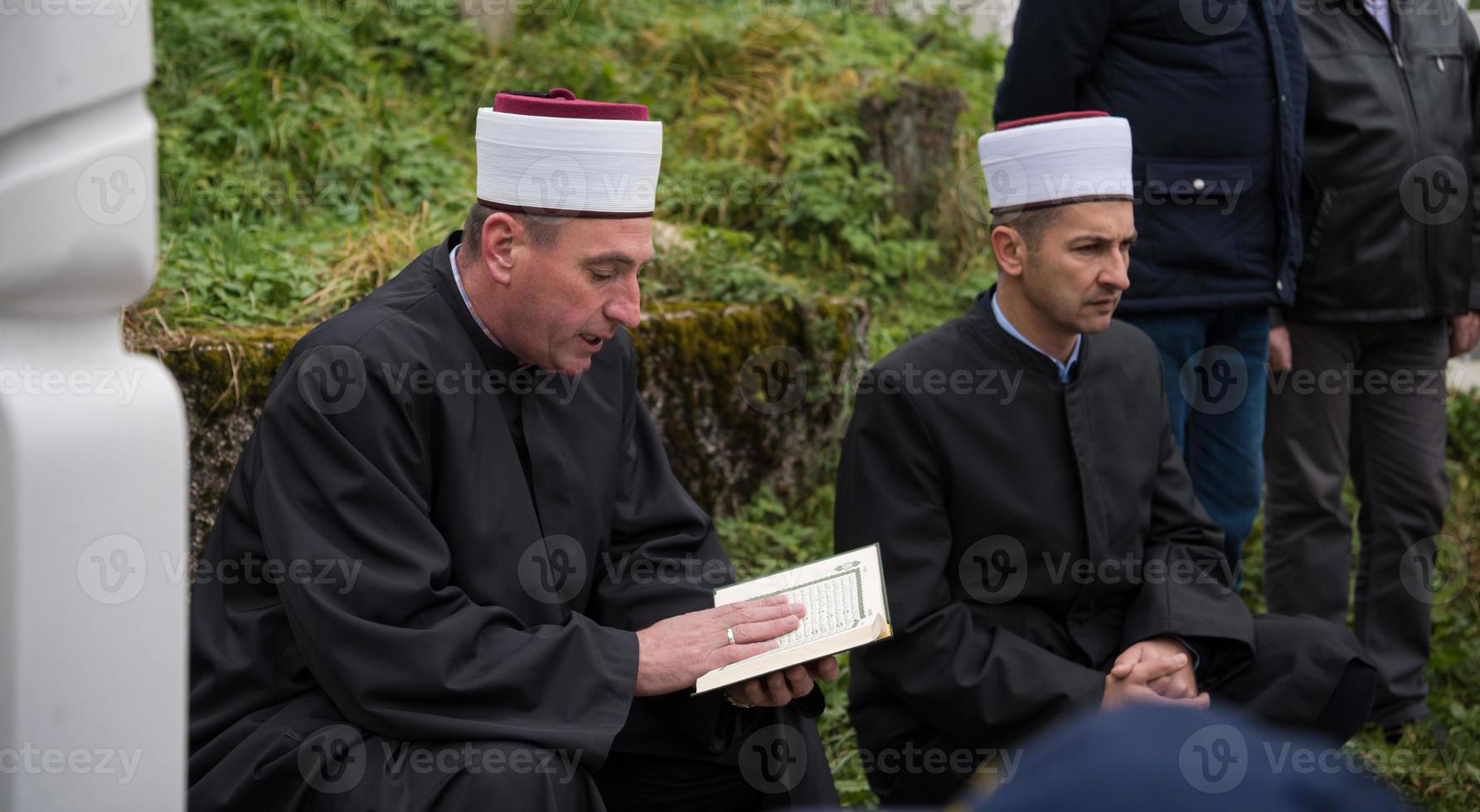 quran holy book reading by imam  on islamic funeral photo