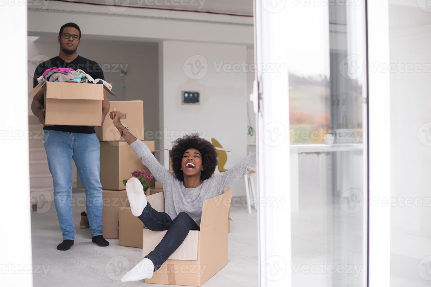 African American couple  playing with packing material photo