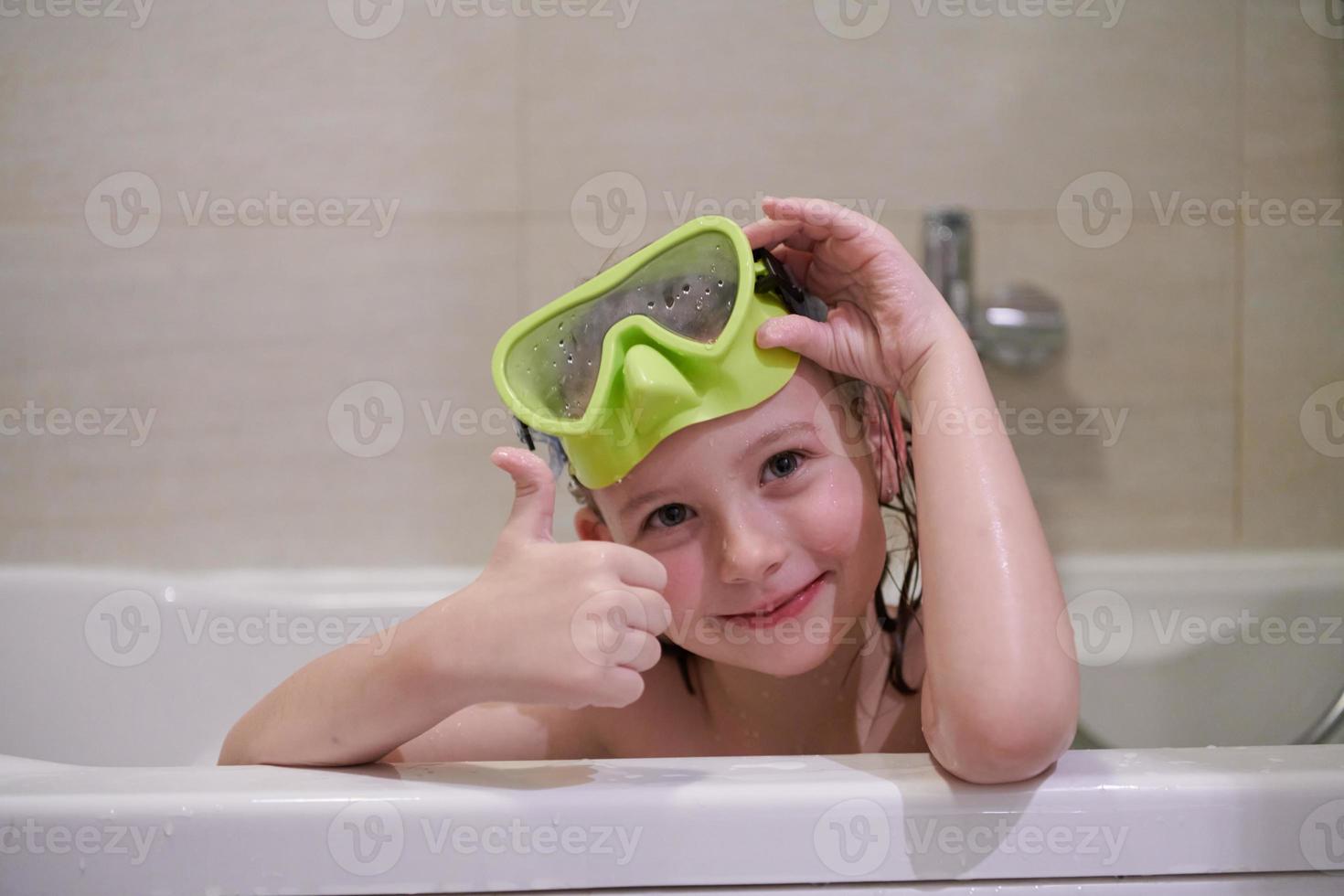 little girl with snorkel goggles photo