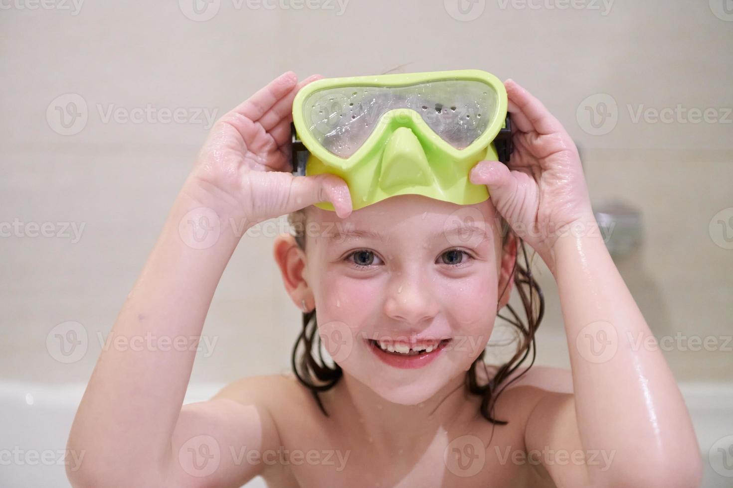 little girl with snorkel goggles photo