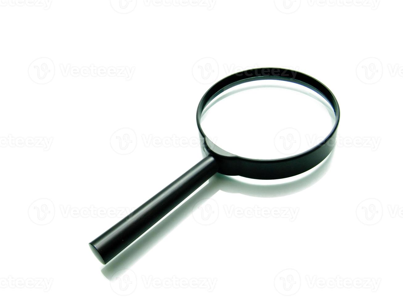 magnifying glass on white photo