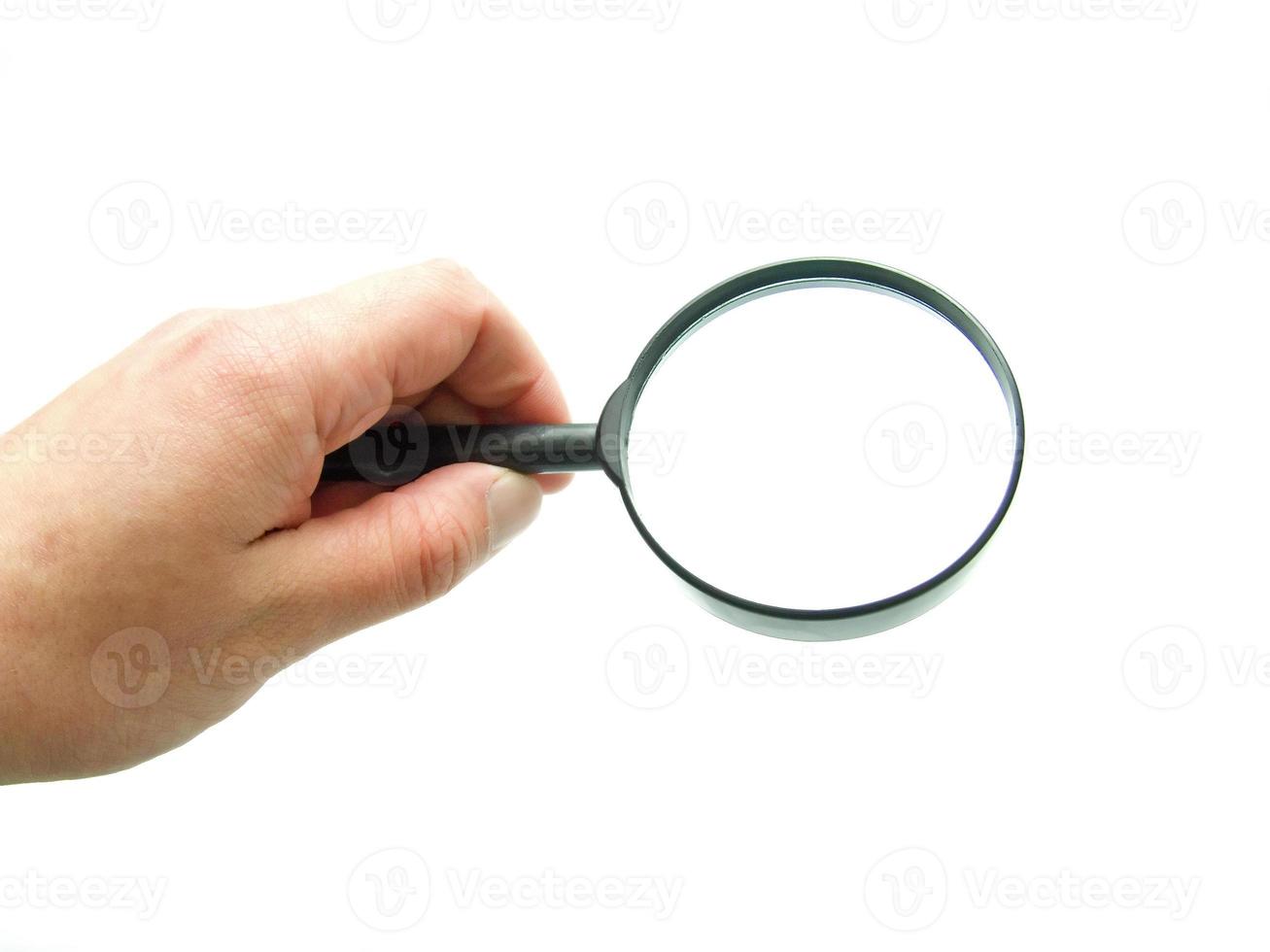 hand with magnifying glass photo