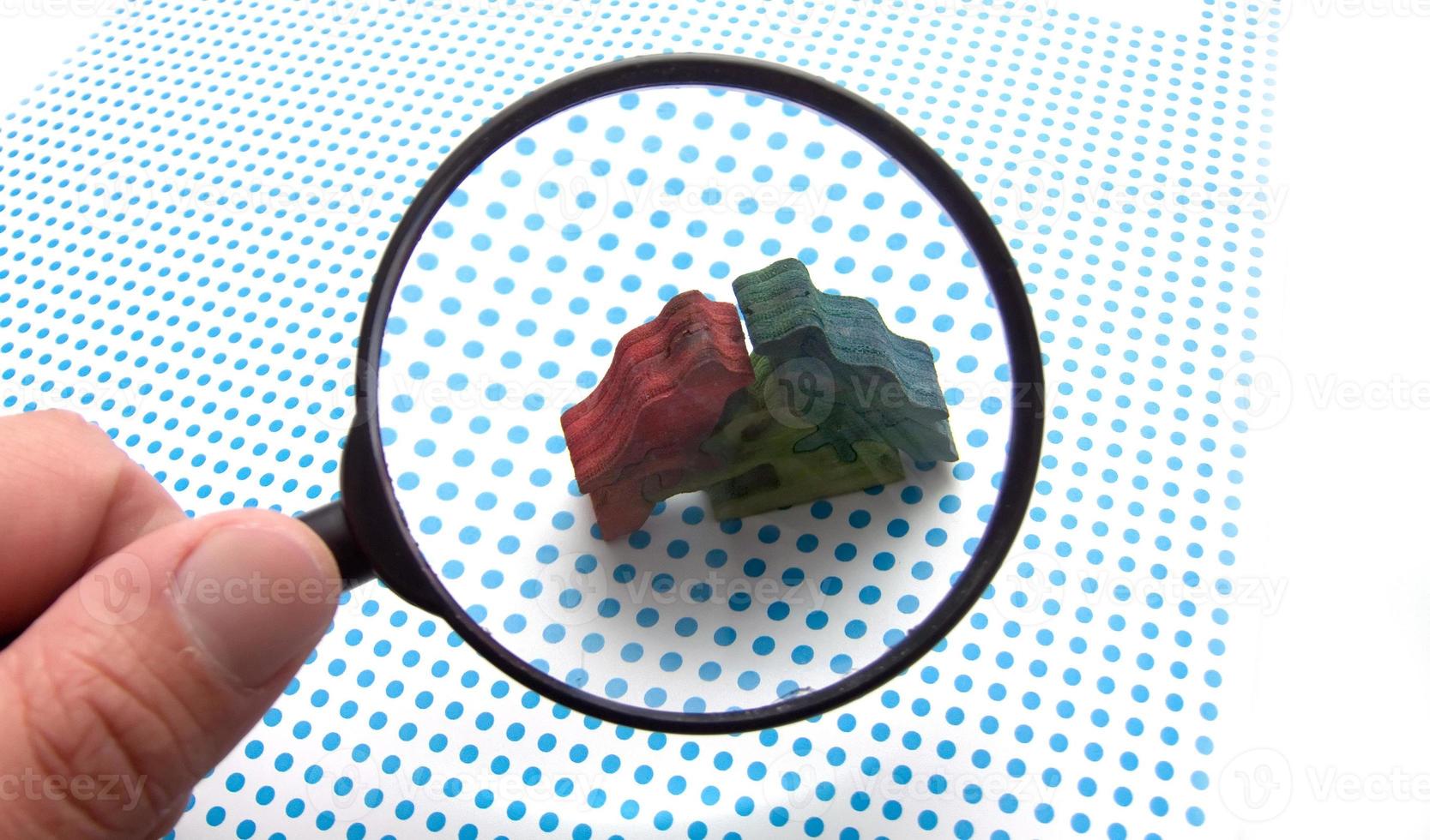 hand with magnifying glass photo