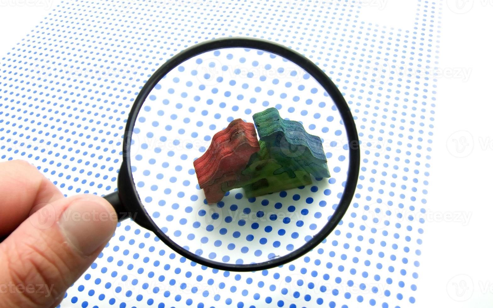 hand with magnifying glass photo