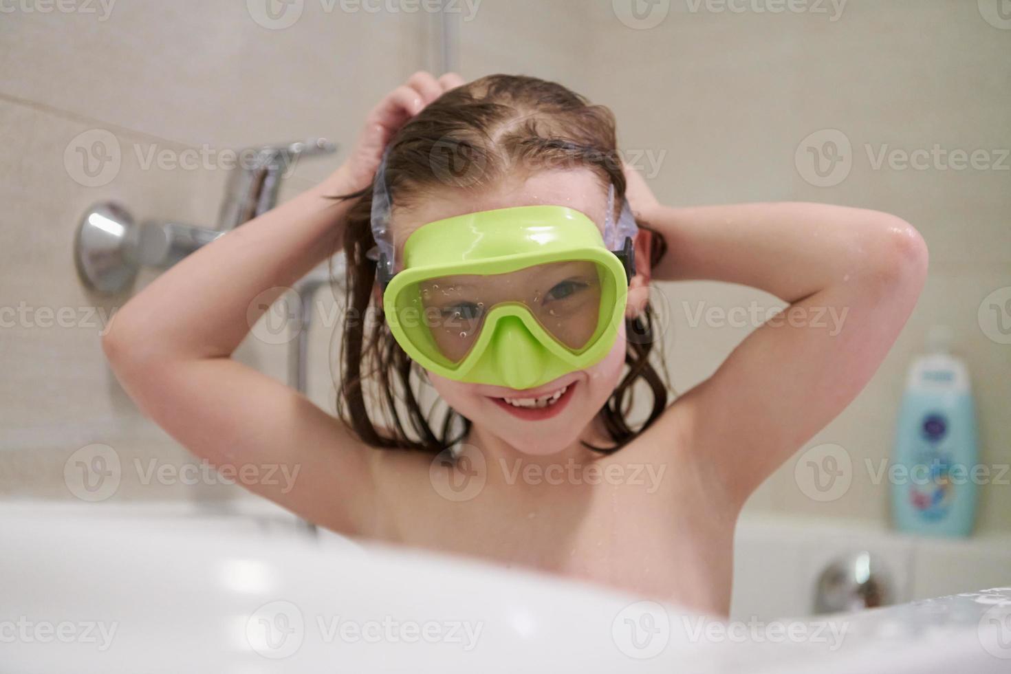 little girl with snorkel goggles photo