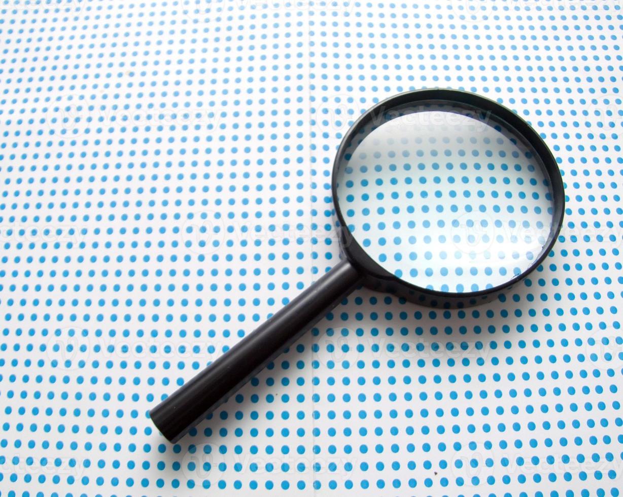 magnifying glass on white photo