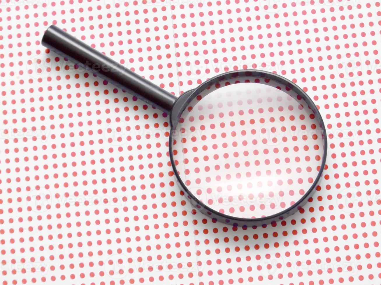magnifying glass on table photo