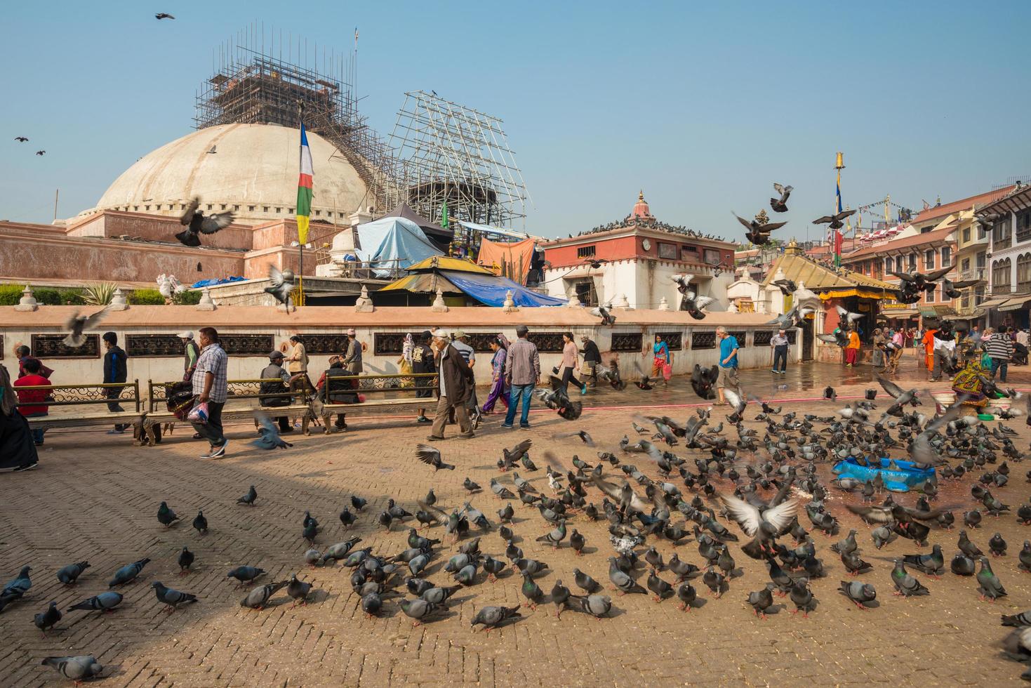 KATHMANDU, NEPAL - APRIL 18 2016 - Boudhanath stupa still repairing after the big earthquake in Nepal. Boudhanath was shaken by a magnitude 7.8 earthquake in April 2015. photo
