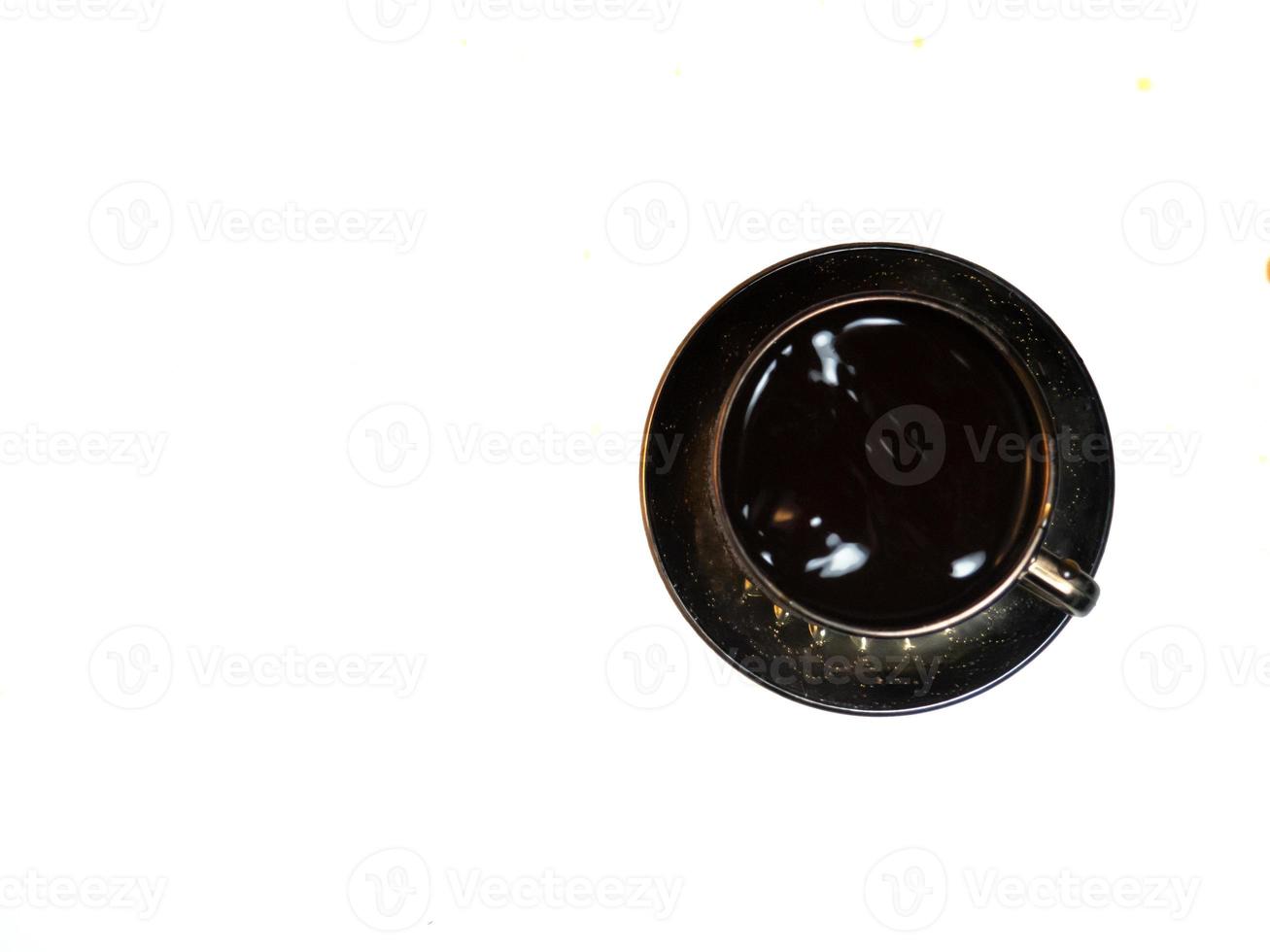 A cup of black coffee on the table. photo