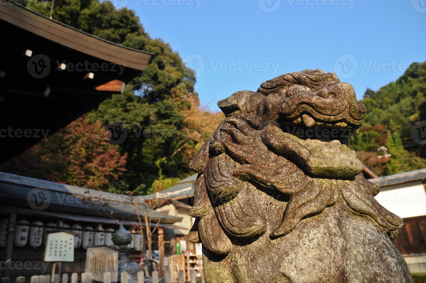 Japanese stone lion statue in old temple, Kyoto, Japan photo