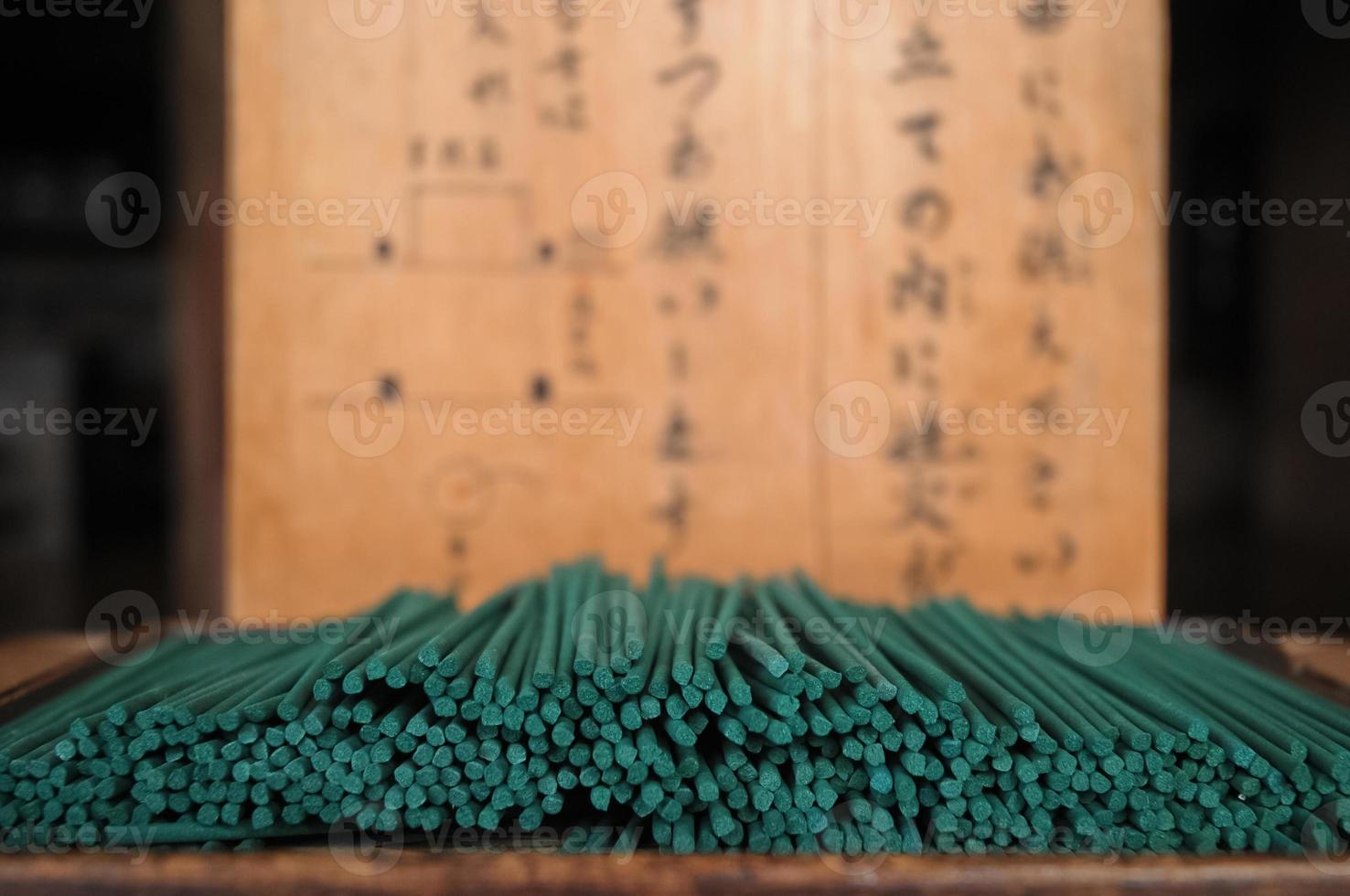 A lady praying at ancient small Japanese shrine photo